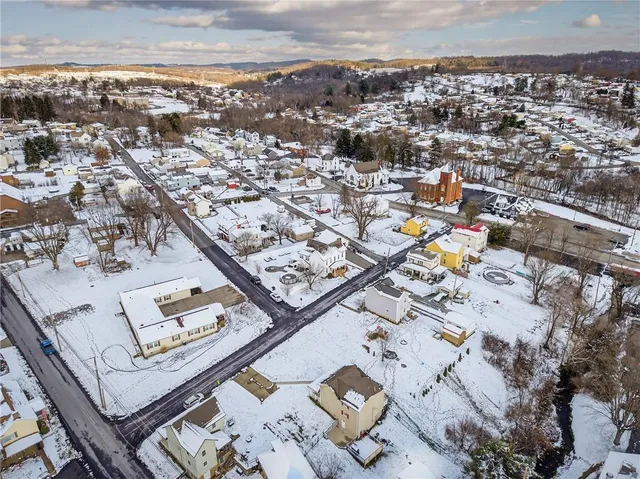 an aerial view of a city with parking