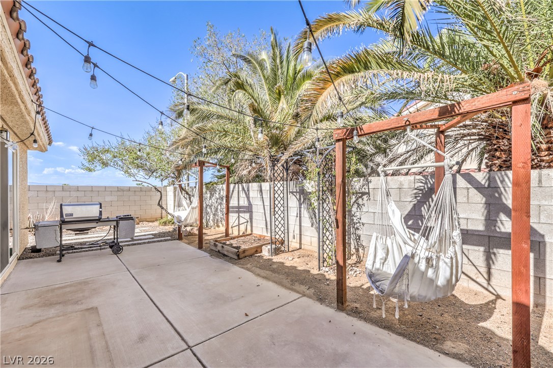 1900 Cardinal Point Street Henderson, NV 89012 - Photo 5 of 32 A spacious backyard patio provides an ideal setting for relaxation and outdoor gatherings.