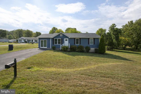 a front view of a house with swimming pool