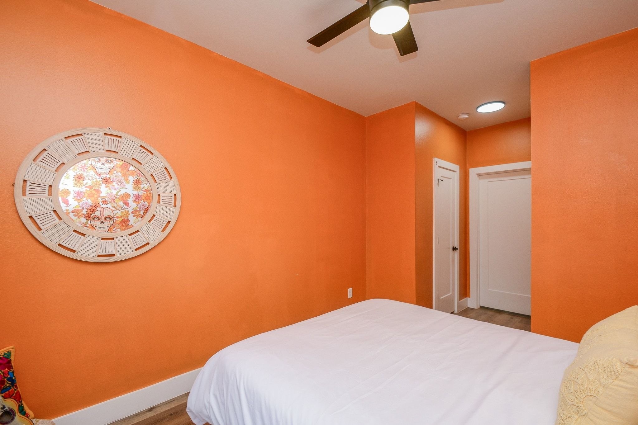 1504 Evelyn Street Houston, TX 77009 - Photo 12 of 15 a bedroom with a bed and a chandelier