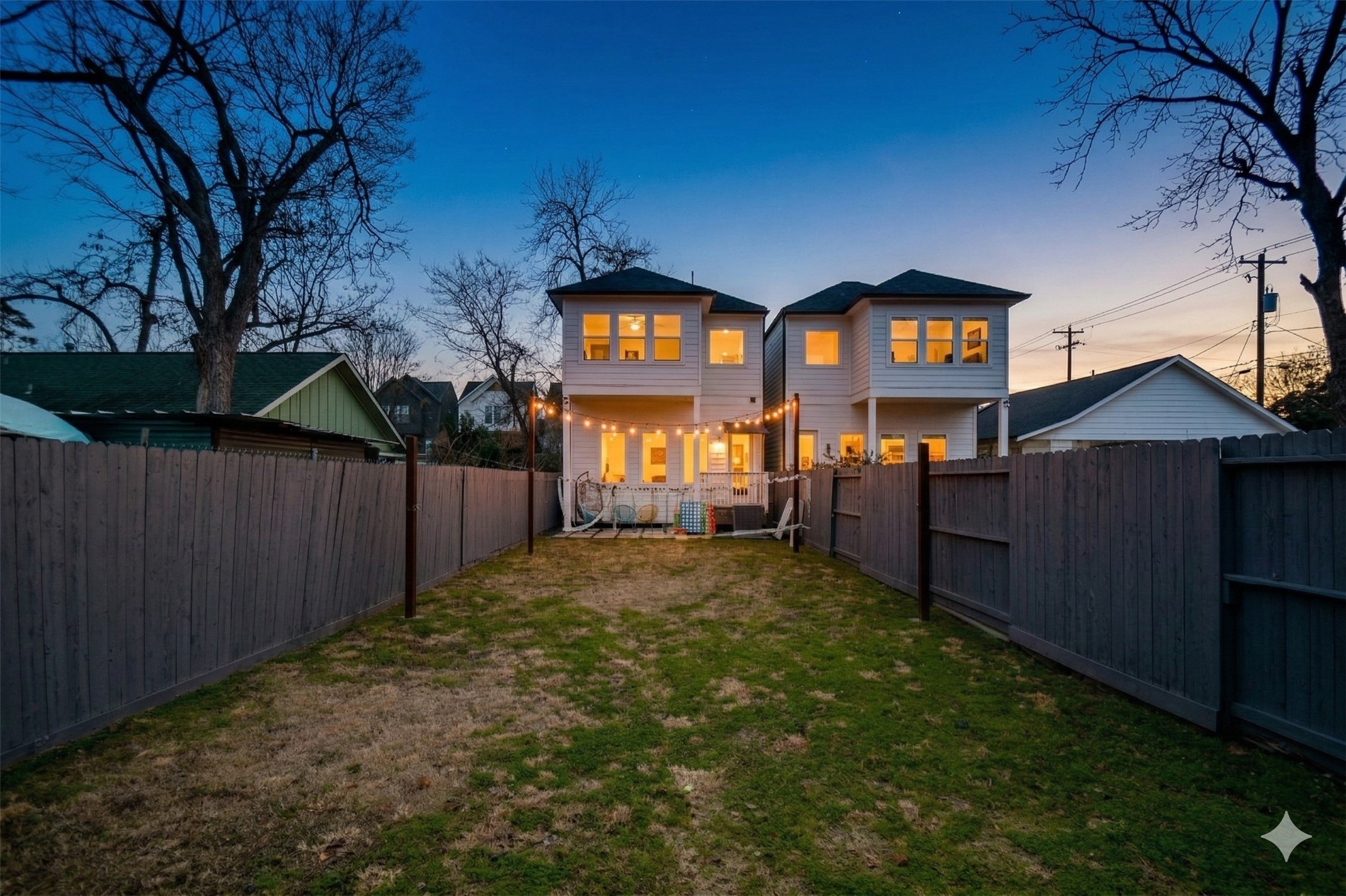 1504 Evelyn Street Houston, TX 77009 - Photo 2 of 15 a view of a backyard with wooden fence and a potted plant