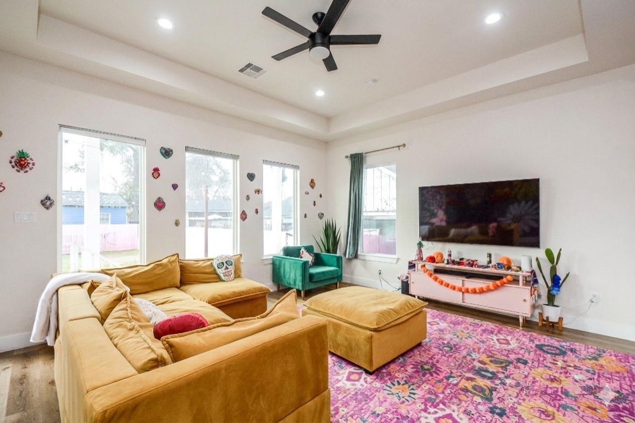 1504 Evelyn Street Houston, TX 77009 - Photo 4 of 15 a living room with furniture and a flat screen tv