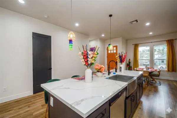 a view of a dining area with furniture window and wooden floor