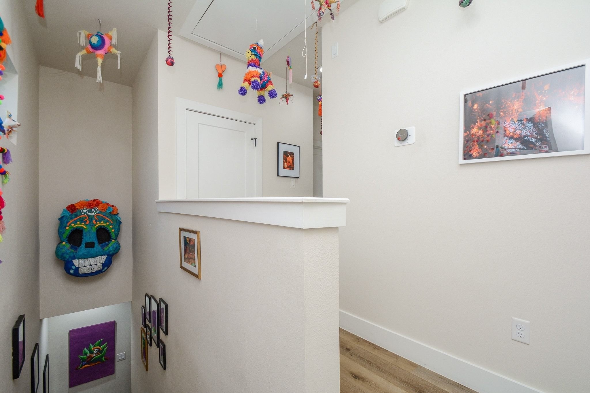 1504 Evelyn Street Houston, TX 77009 - Photo 9 of 15 a cabinet with painting on the wall and a potted plant