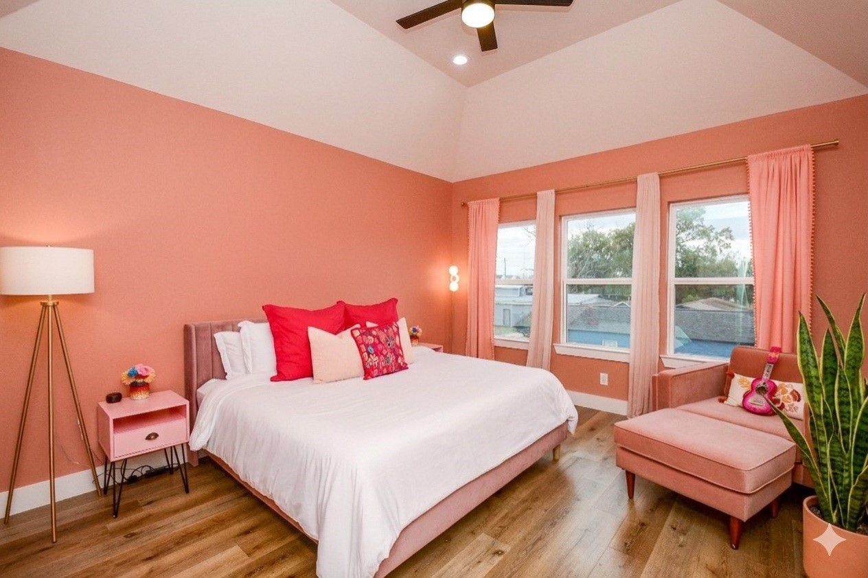 1504 Evelyn Street Houston, TX 77009 - Photo 10 of 15 a bedroom with a bed and a couch
