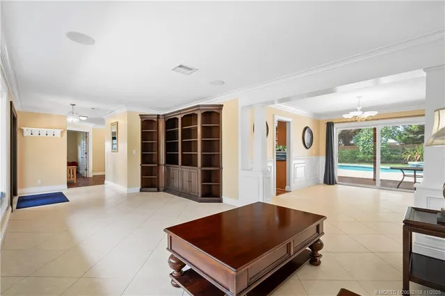 a dining hall with stainless steel appliances granite countertop a stove and a refrigerator