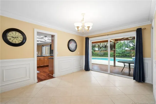 a kitchen with stainless steel appliances granite countertop a refrigerator and a stove