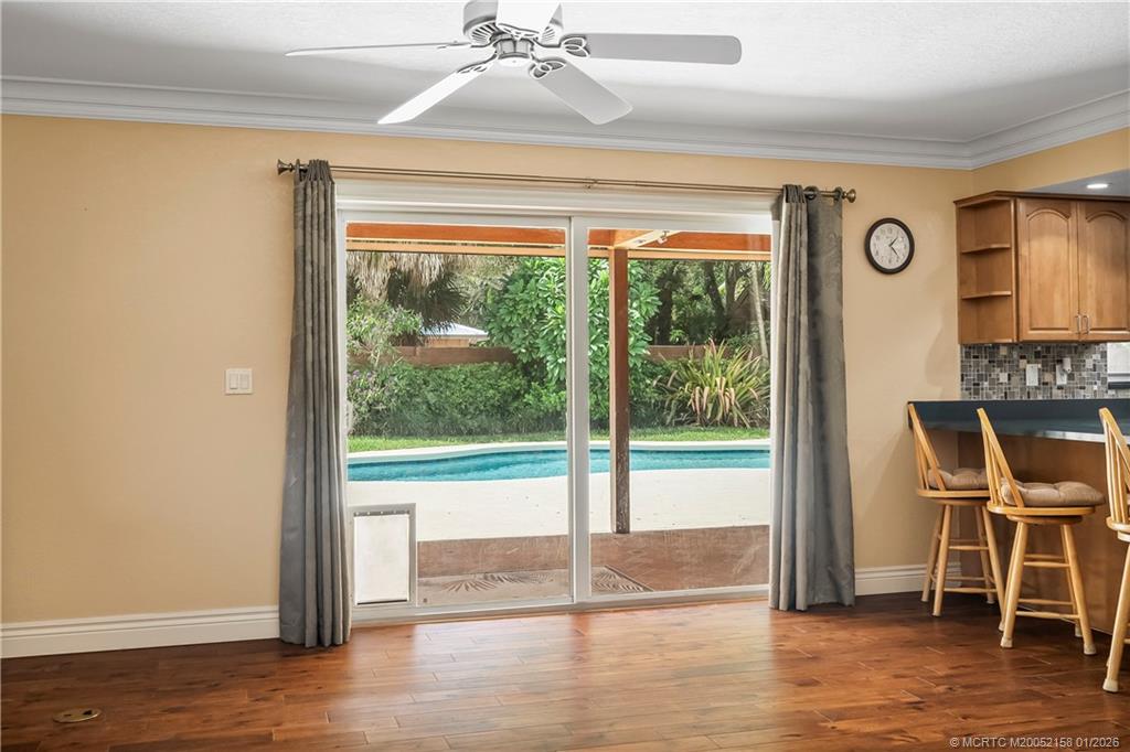 2164 Southeast St Lucie Boulevard Stuart, FL 34996 - Photo 24 of 60 a view of a room with wooden floor and windows