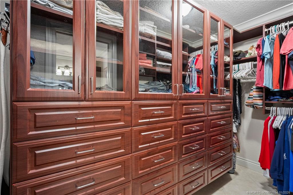 2164 Southeast St Lucie Boulevard Stuart, FL 34996 - Photo 34 of 60 a view of walk in closet with clothes and shoes
