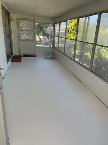 a kitchen with granite countertop a sink a stove and cabinets