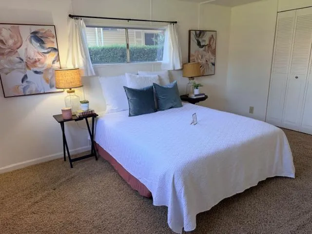 a bedroom with a bed and window