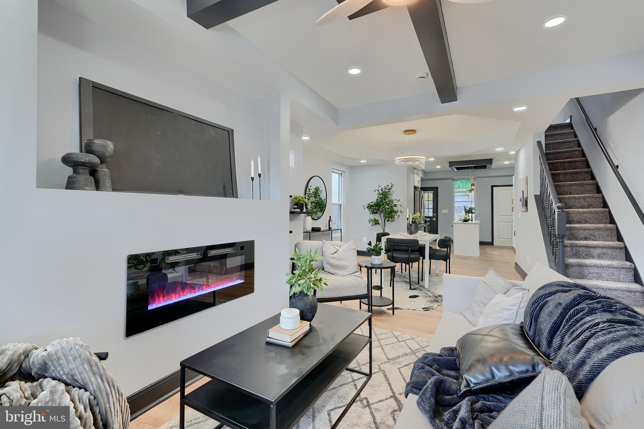 5012 Belair Road Baltimore, MD 21206 - Photo 11 of 61 a living room with furniture and a fireplace