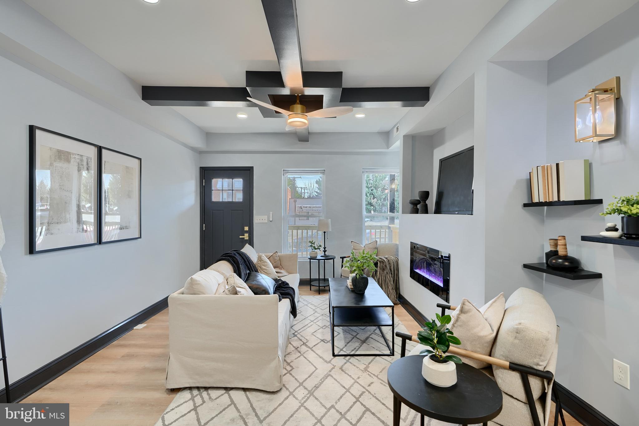 5012 Belair Road Baltimore, MD 21206 - Photo 13 of 61 a living room with furniture and a fireplace