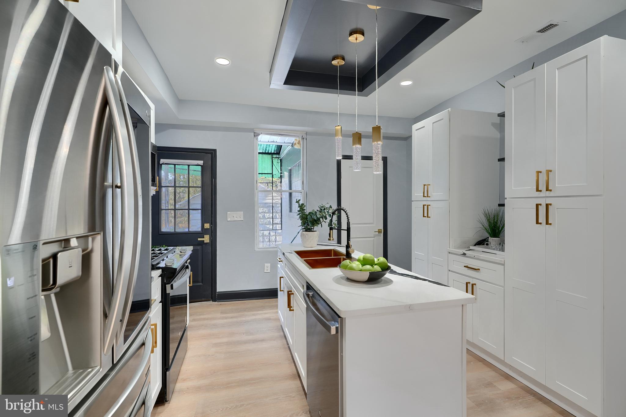 5012 Belair Road Baltimore, MD 21206 - Photo 23 of 61 a kitchen with stainless steel appliances a refrigerator and a stove