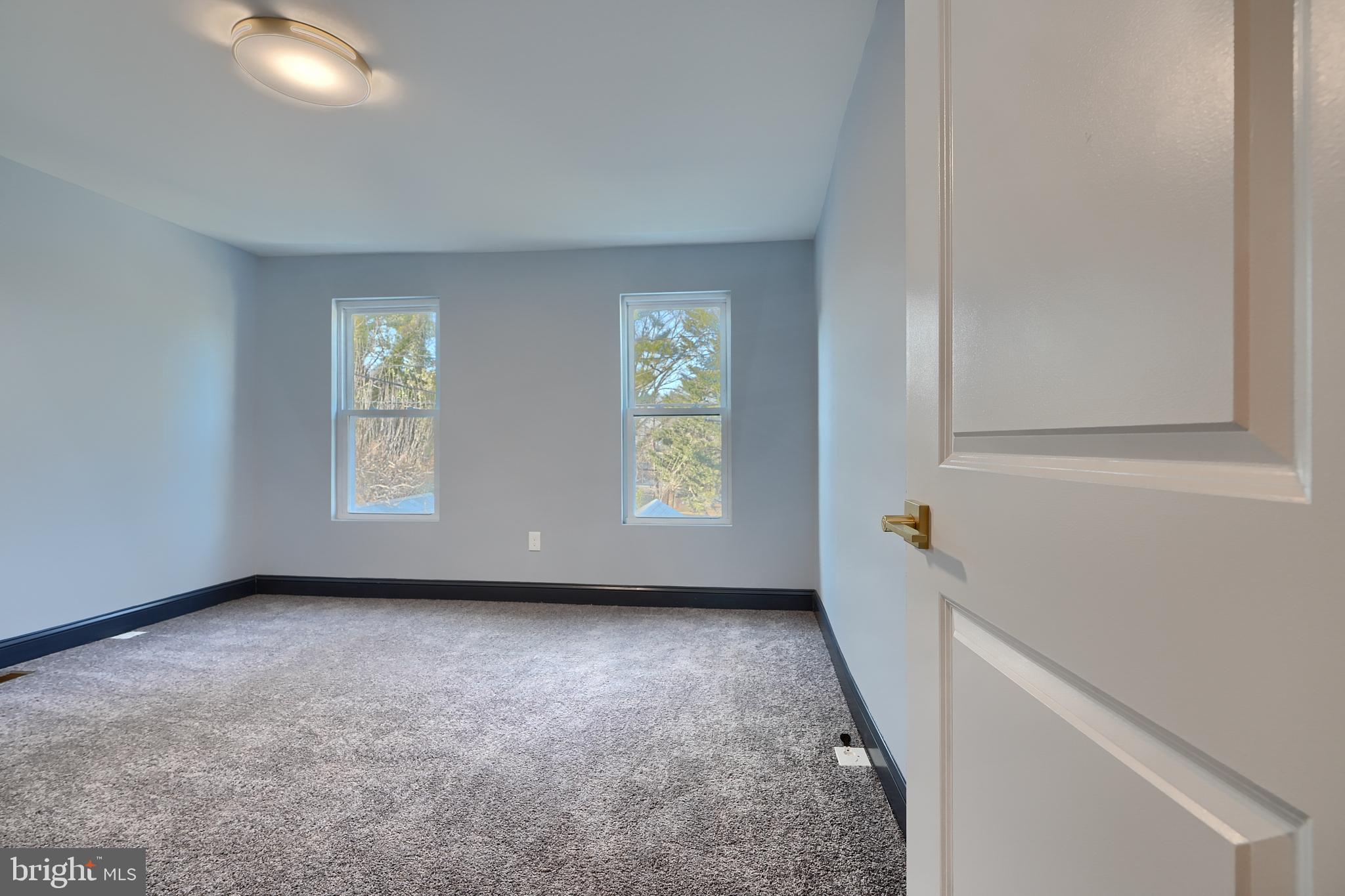 5012 Belair Road Baltimore, MD 21206 - Photo 30 of 61 an empty room with windows