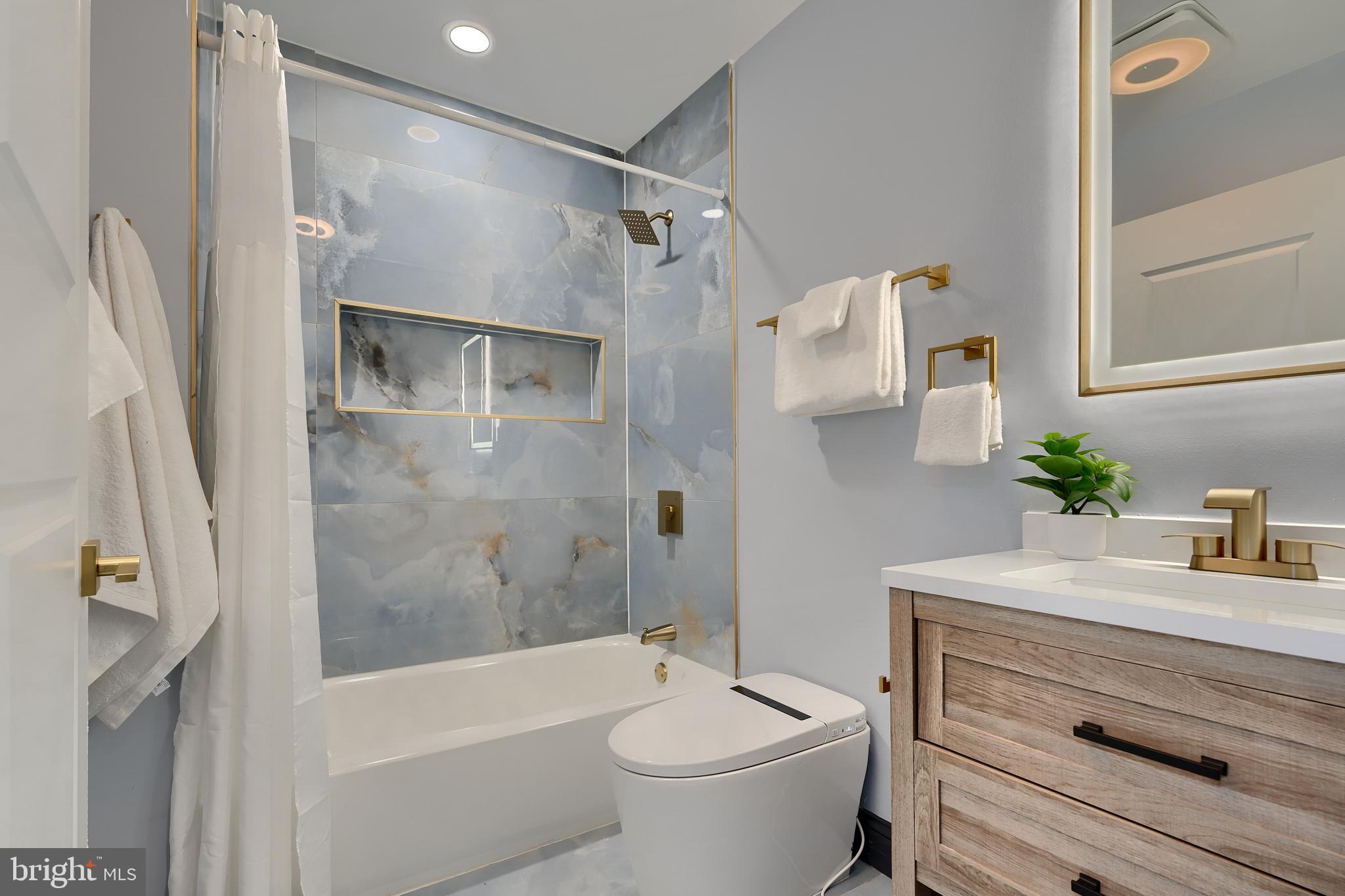 5012 Belair Road Baltimore, MD 21206 - Photo 41 of 61 a bathroom with a sink toilet and shower