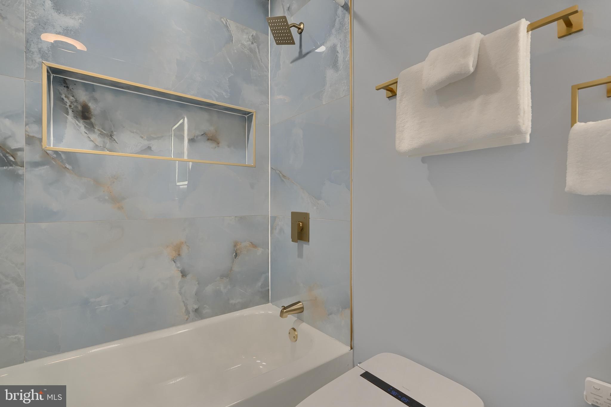 5012 Belair Road Baltimore, MD 21206 - Photo 42 of 61 a bathroom with a bathtub and shower