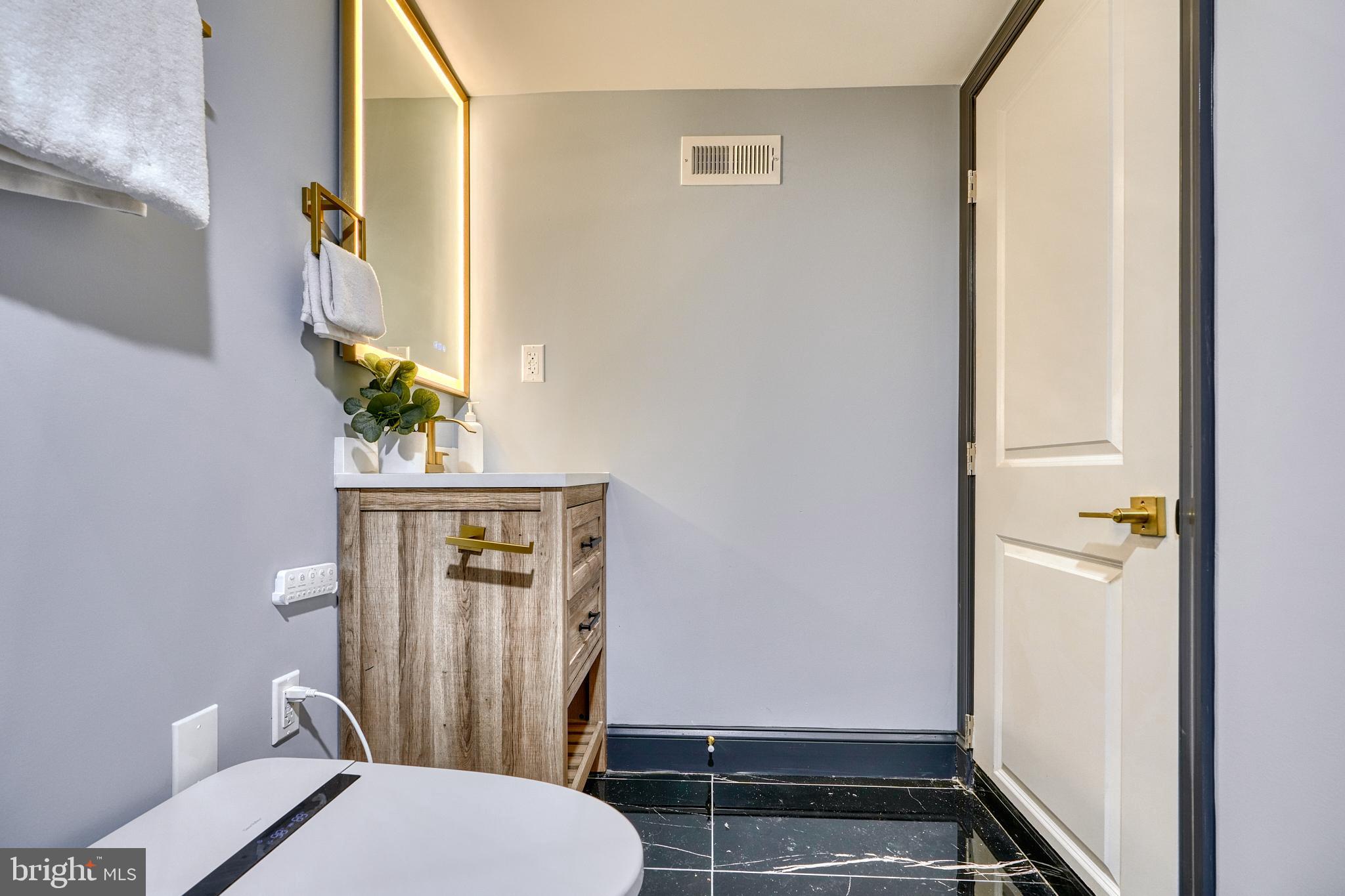 5012 Belair Road Baltimore, MD 21206 - Photo 46 of 61 a bathroom with a toilet and a shower