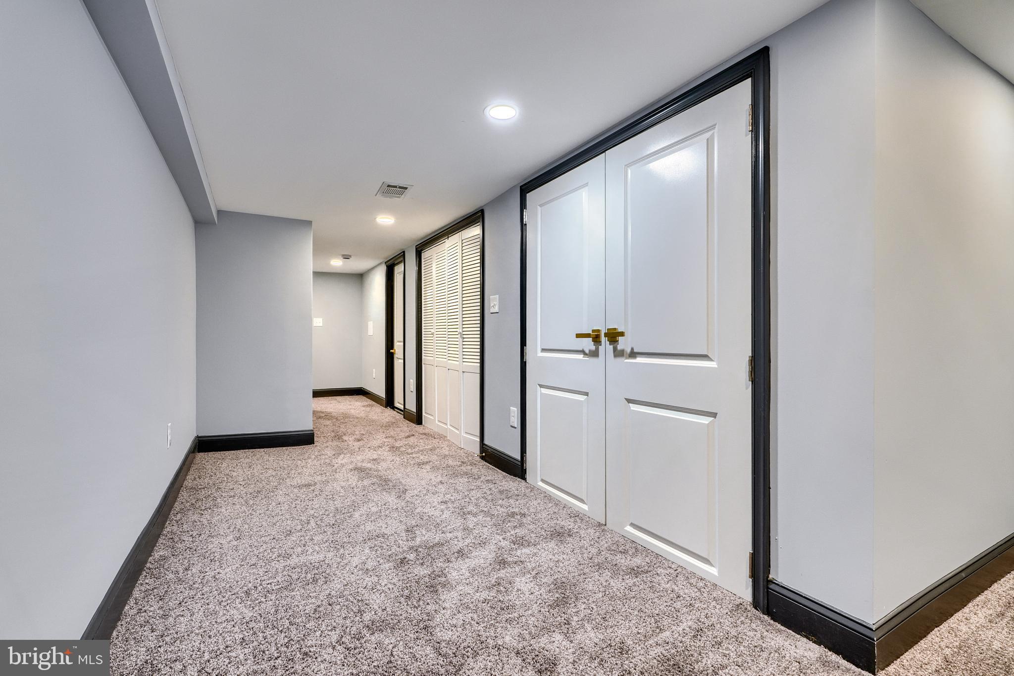 5012 Belair Road Baltimore, MD 21206 - Photo 52 of 61 an empty room with closet and wooden floor