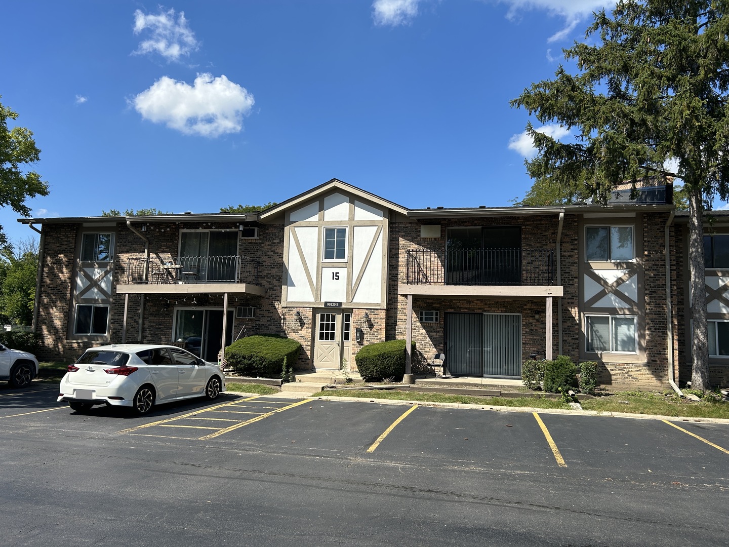 a view of a car park in front of house