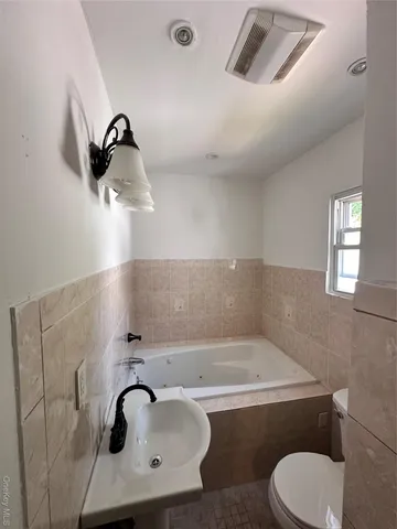 a bathroom with a sink and mirror