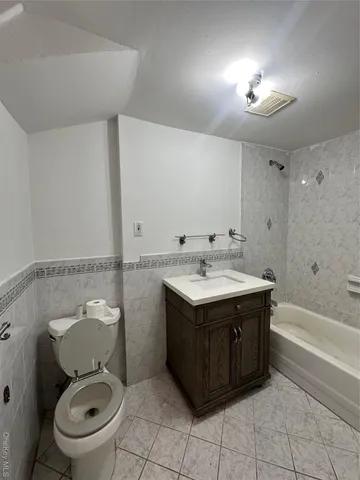 a large kitchen with cabinets and stainless steel appliances