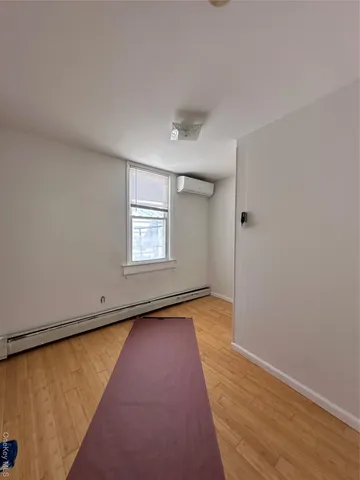 a view of an empty room and window