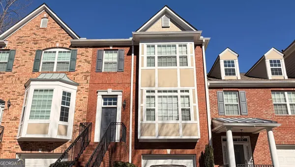 a front view of a house with many windows