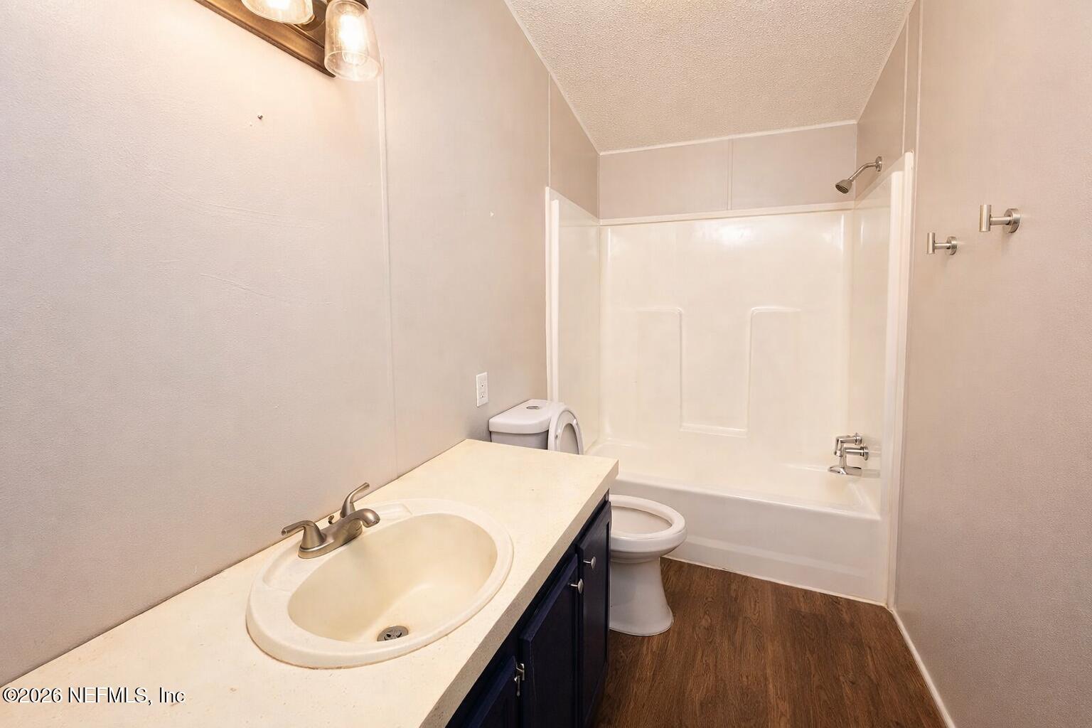 54052 Dornbush Road Callahan, FL 32011 - Photo 6 of 27 a bathroom with a sink toilet and shower