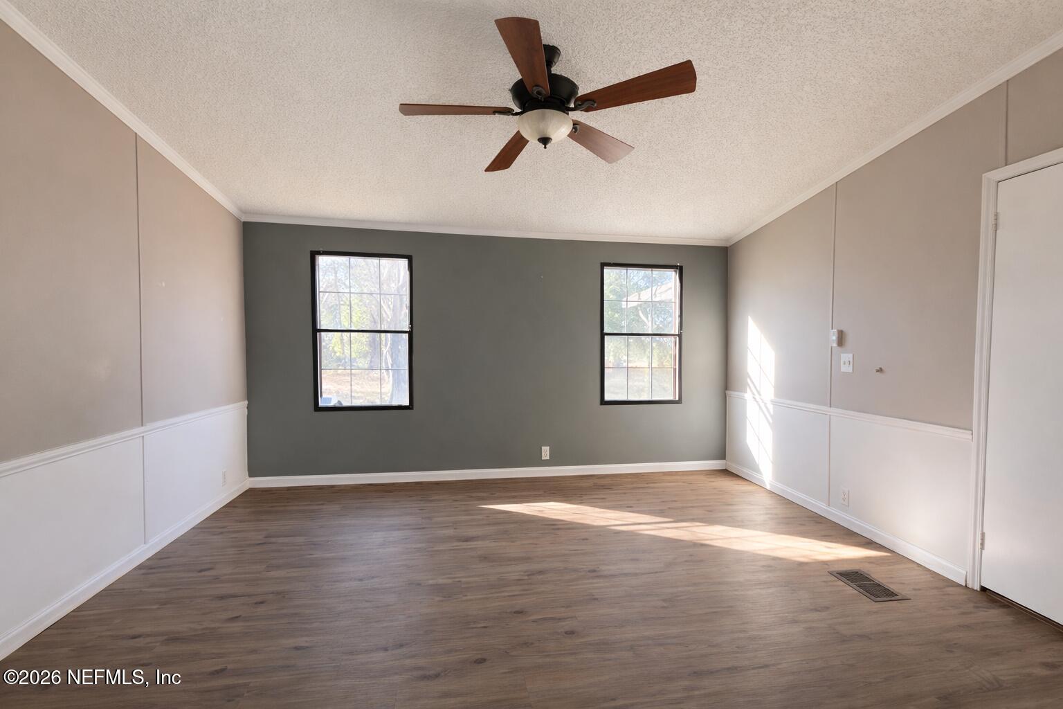 54052 Dornbush Road Callahan, FL 32011 - Photo 10 of 27 a view of a livingroom with a ceiling fan and window