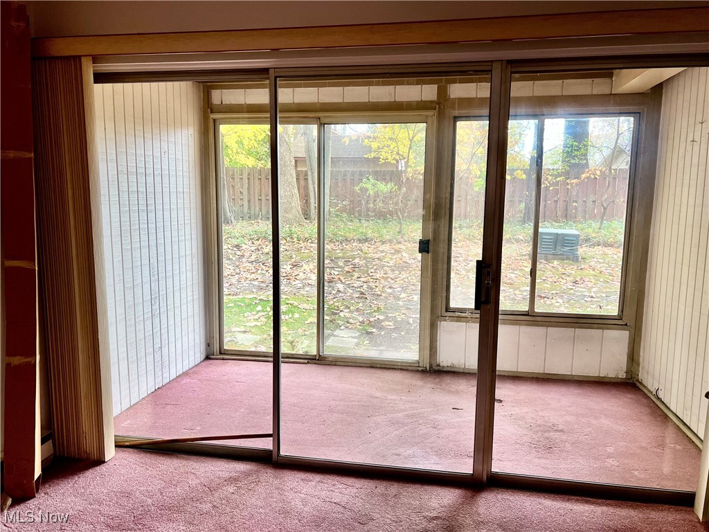 3068 Kent Road, Unit 105C Stow, OH 44224 - Photo 8 of 42 Doors lead to sun room and to the outside wooded grounds