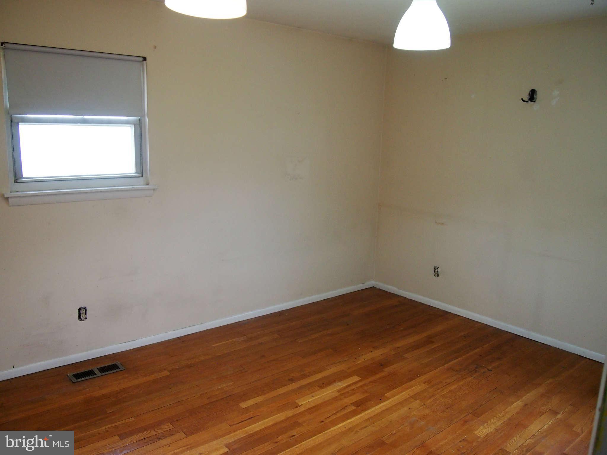319 Holly Manor Road Baltimore, MD 21228 - Photo 11 of 17 a view of a room that has a window