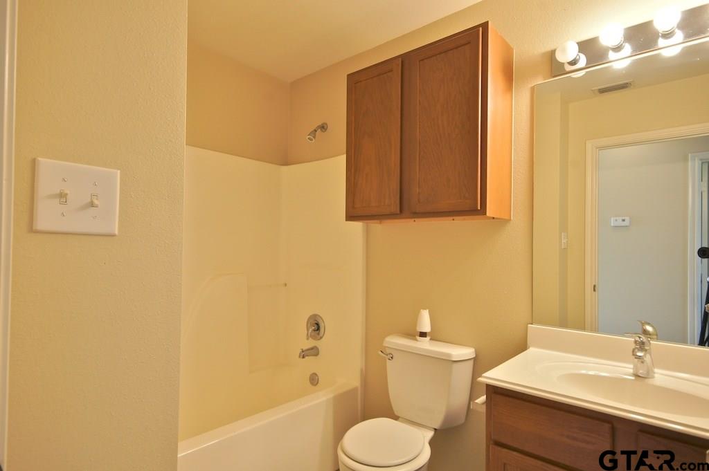 613 Hagan Road Whitehouse, TX 75791 - Photo 17 of 22 a bathroom with a sink toilet and shower