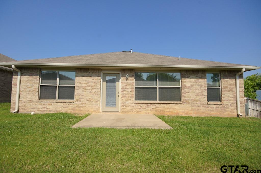 613 Hagan Road Whitehouse, TX 75791 - Photo 20 of 22 a front view of a house with a garden