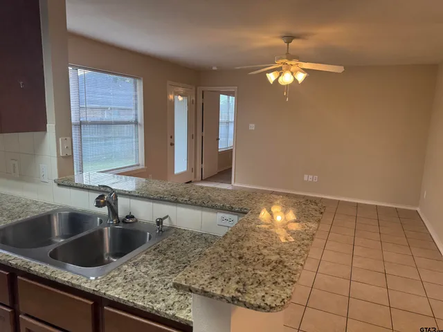 a kitchen with a sink and cabinets