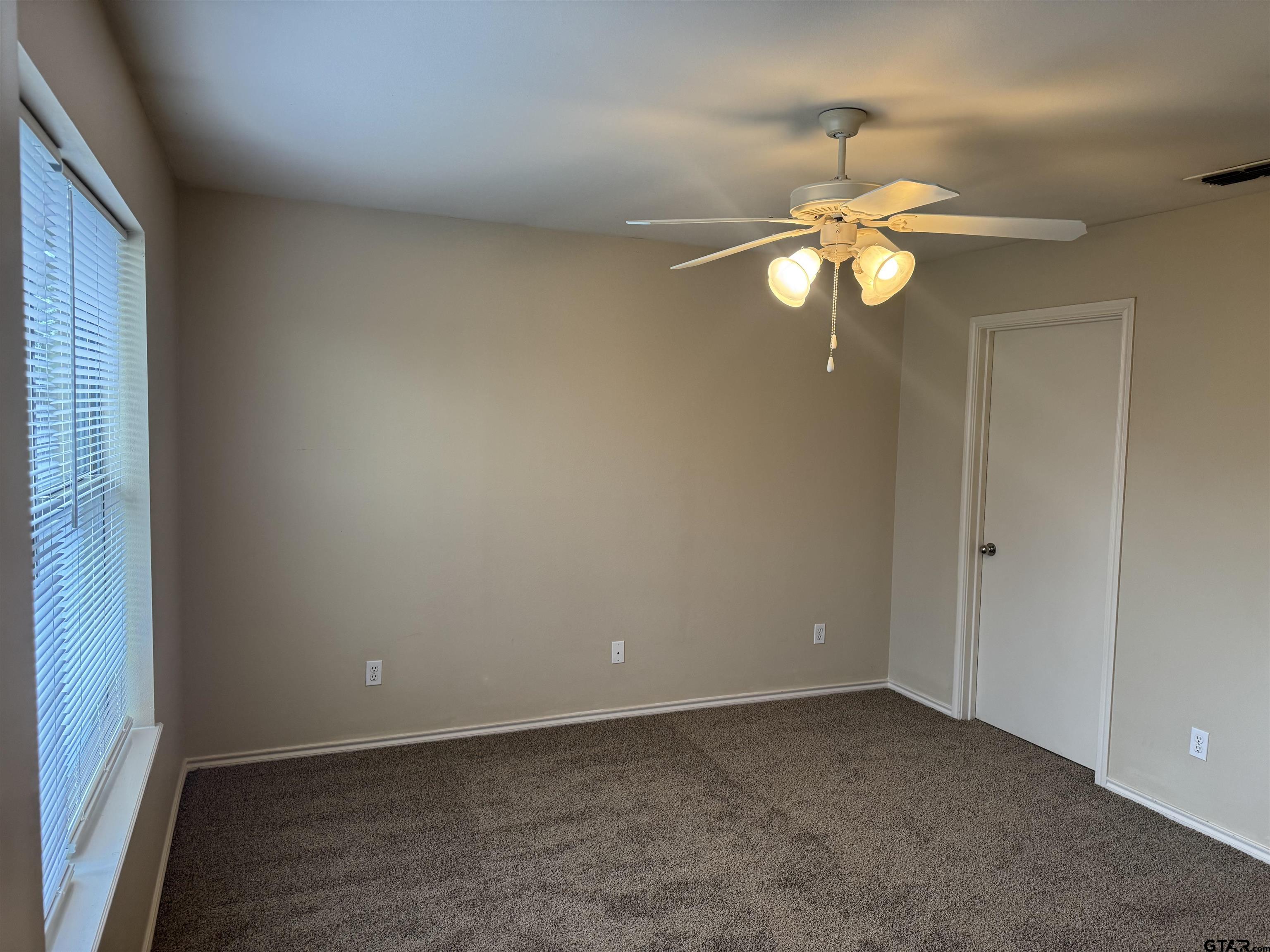613 Hagan Road Whitehouse, TX 75791 - Photo 10 of 22 a view of an empty room with a window
