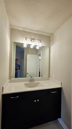 a white toilet sitting next to a bath tub and a shower