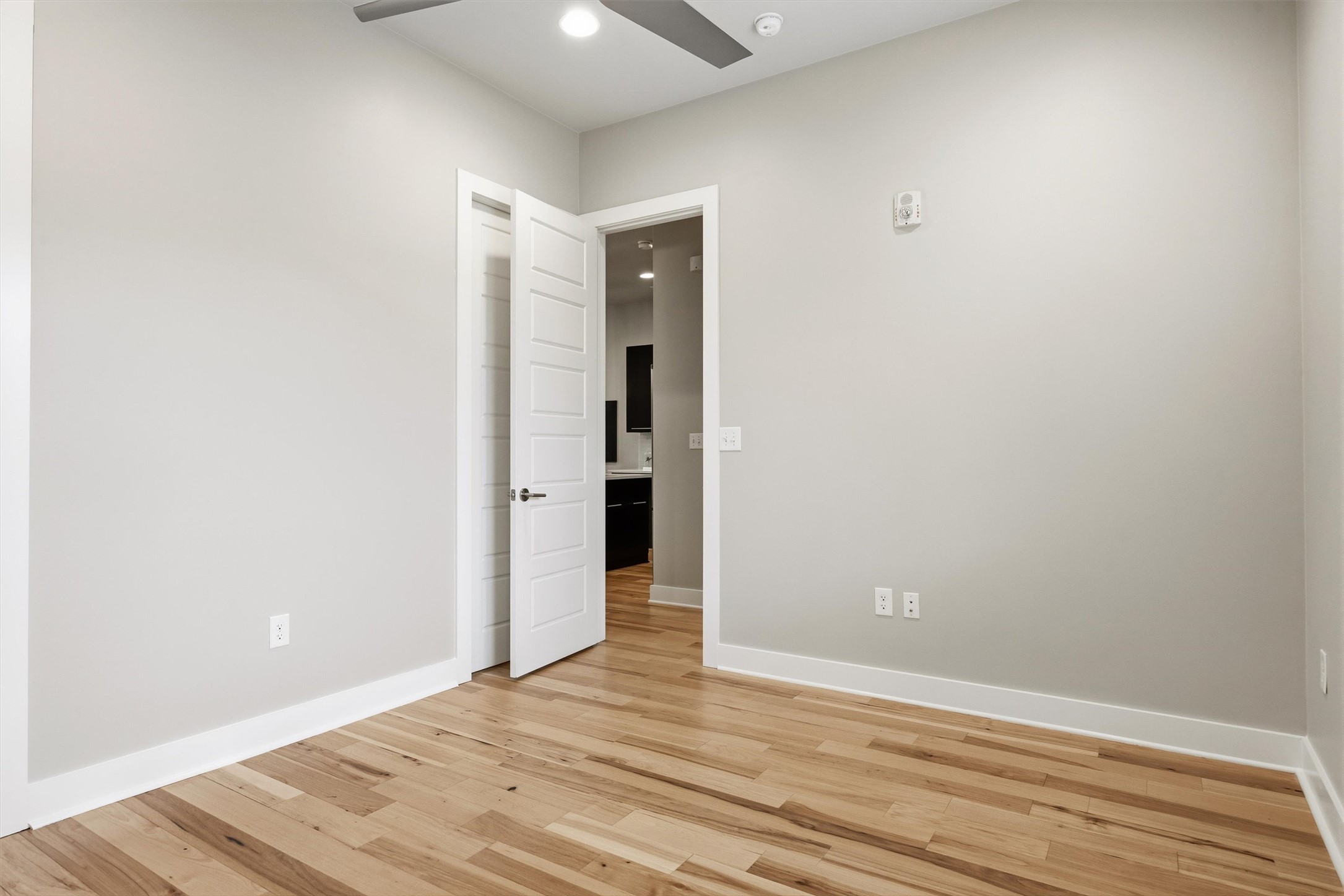 2314 Enfield Road, Unit 203 Austin, TX 78703 - Photo 25 of 37 Hardwood floors and high ceilings carry the same elevated feel found throughout the rest of the unit.
