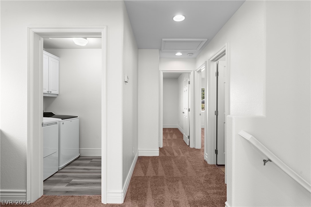 181 Short Ruff Way Las Vegas, NV 89148 - Photo 11 of 43 Corridor featuring dark colored carpet, washer and clothes dryer, recessed lighting, and an upstairs landing