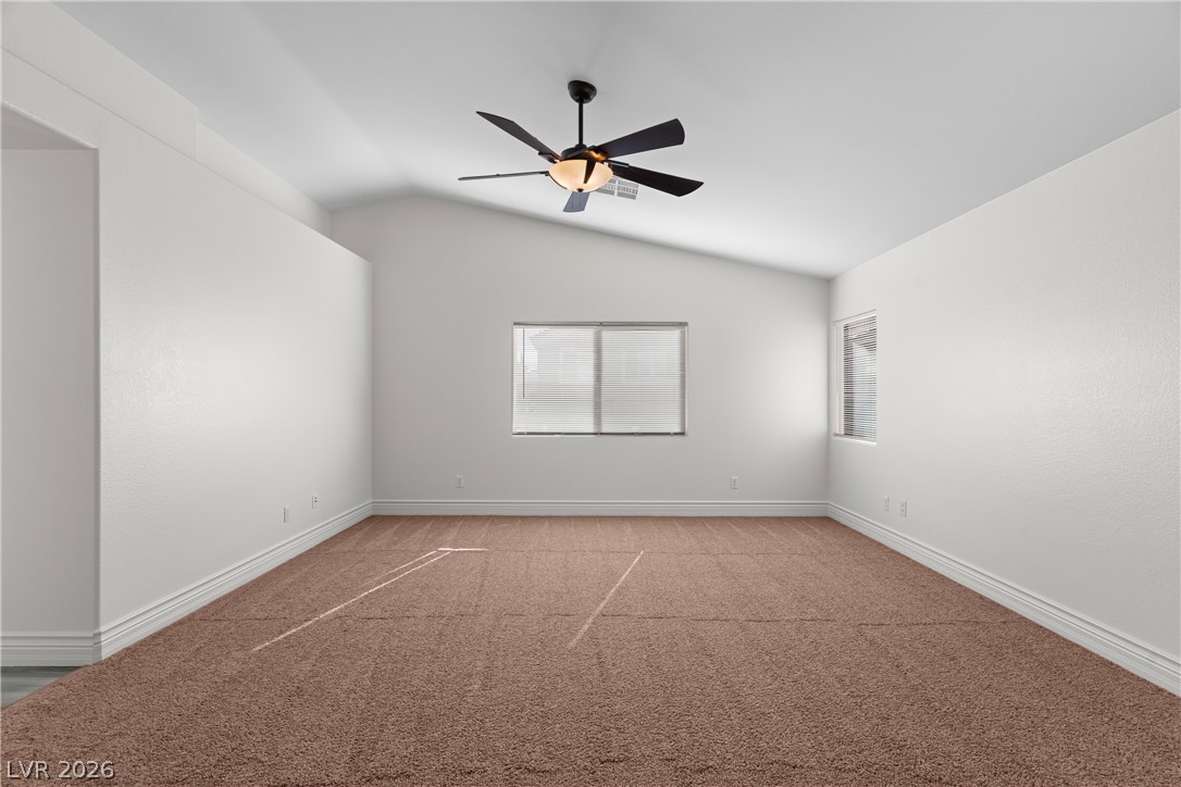 181 Short Ruff Way Las Vegas, NV 89148 - Photo 14 of 43 Spare room with carpet floors, lofted ceiling, and ceiling fan