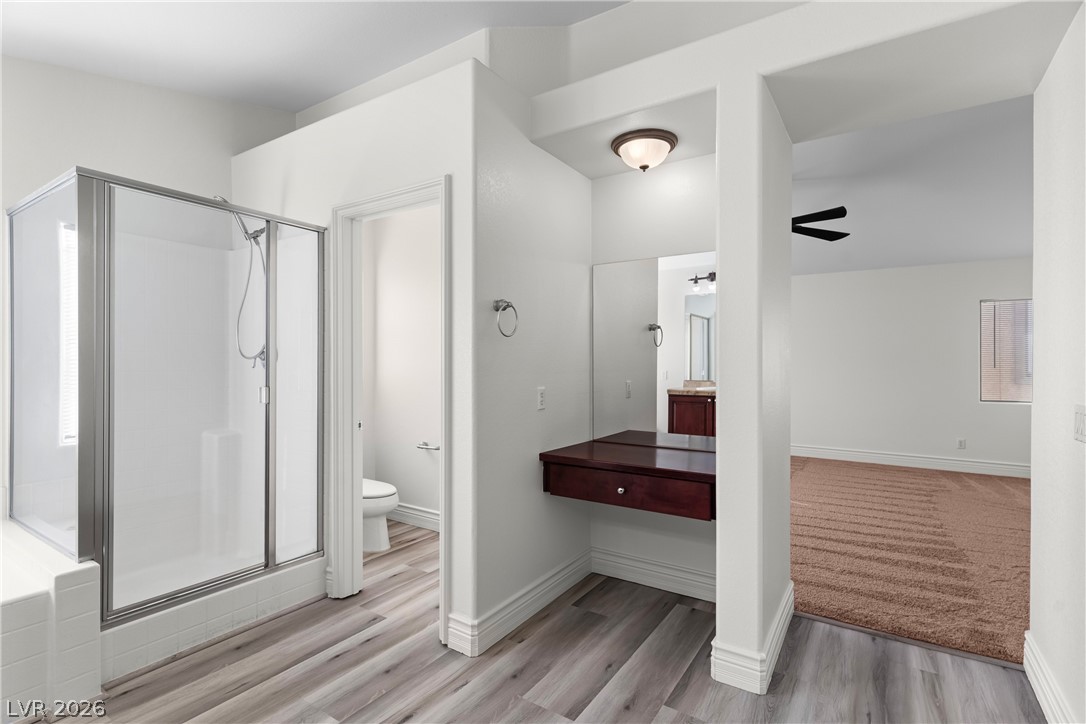 181 Short Ruff Way Las Vegas, NV 89148 - Photo 16 of 43 Full bathroom featuring vanity, a stall shower, and light wood finished floors