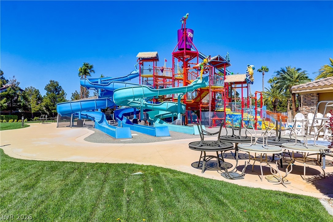 181 Short Ruff Way Las Vegas, NV 89148 - Photo 37 of 43 Communal playground featuring a lawn and a patio