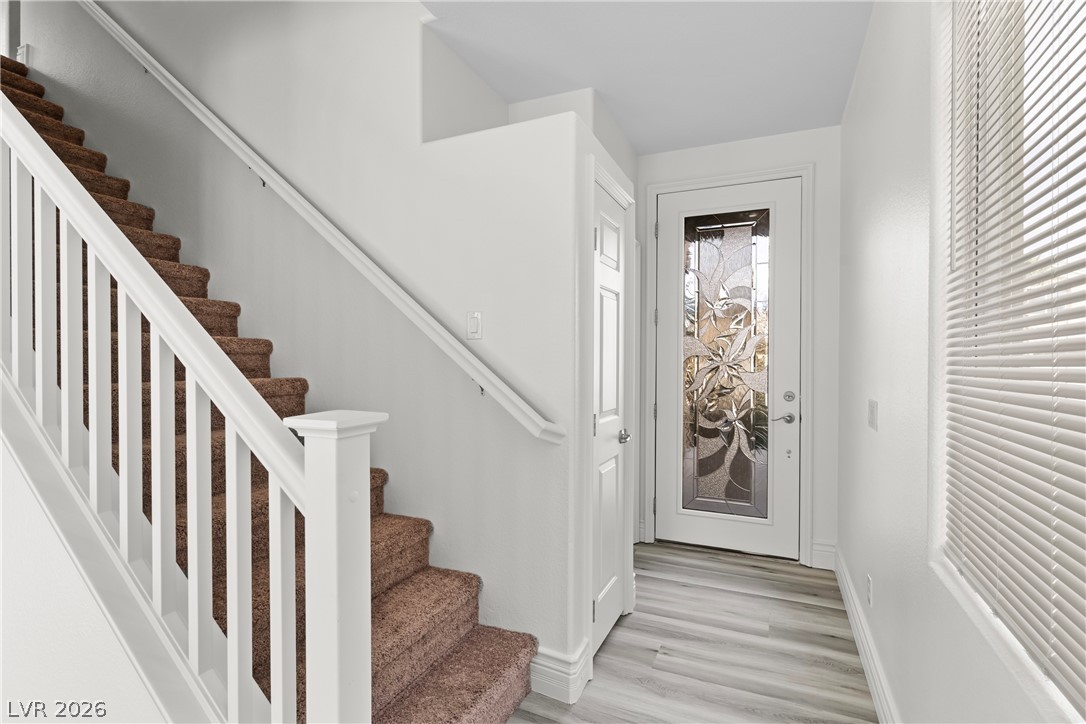 181 Short Ruff Way Las Vegas, NV 89148 - Photo 5 of 43 Entrance foyer with stairway and light wood-type flooring