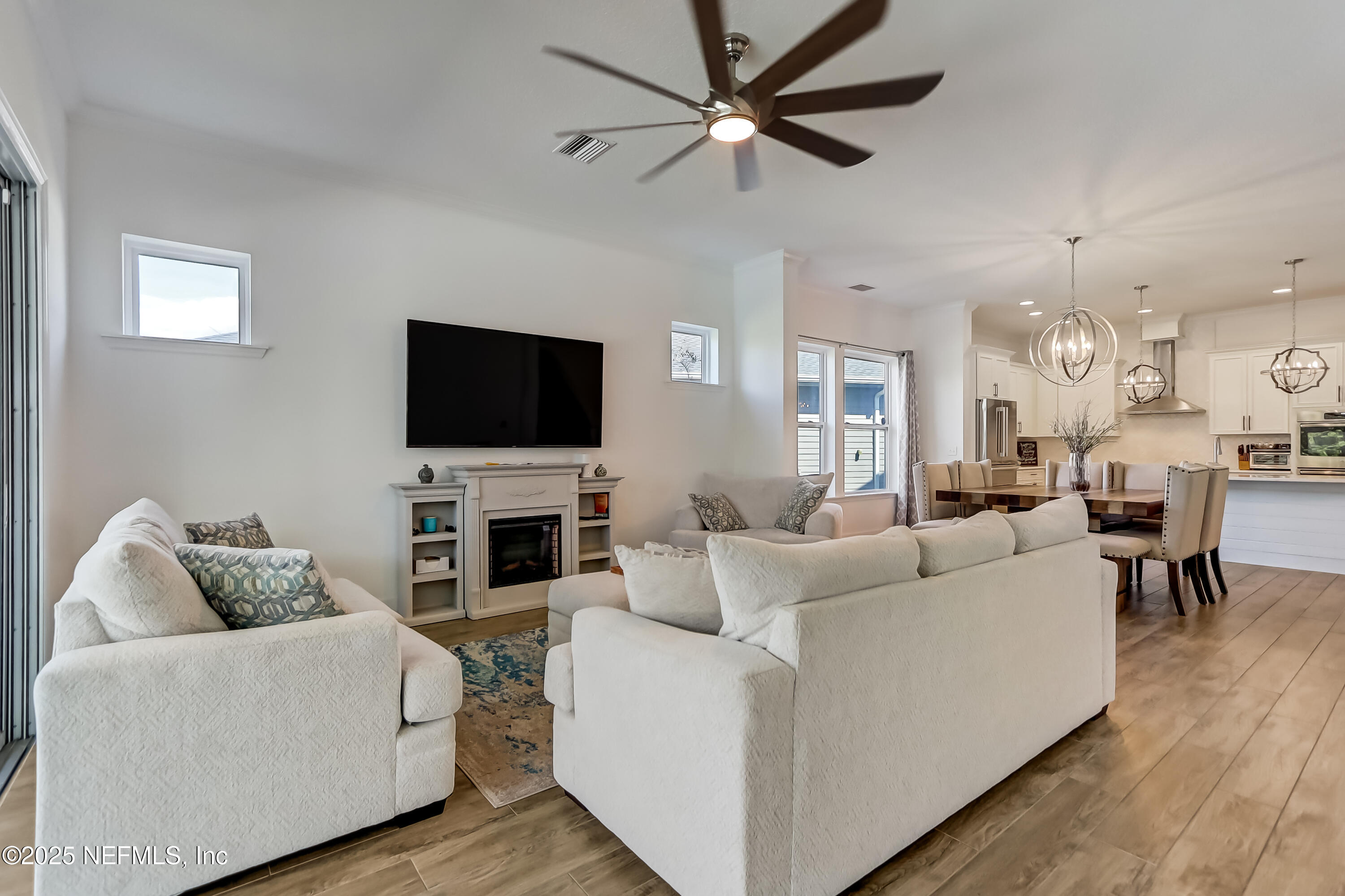 385 Daniel Park Circle Ponte Vedra, FL 32081 - Photo 11 of 34 a living room with furniture and a flat screen tv