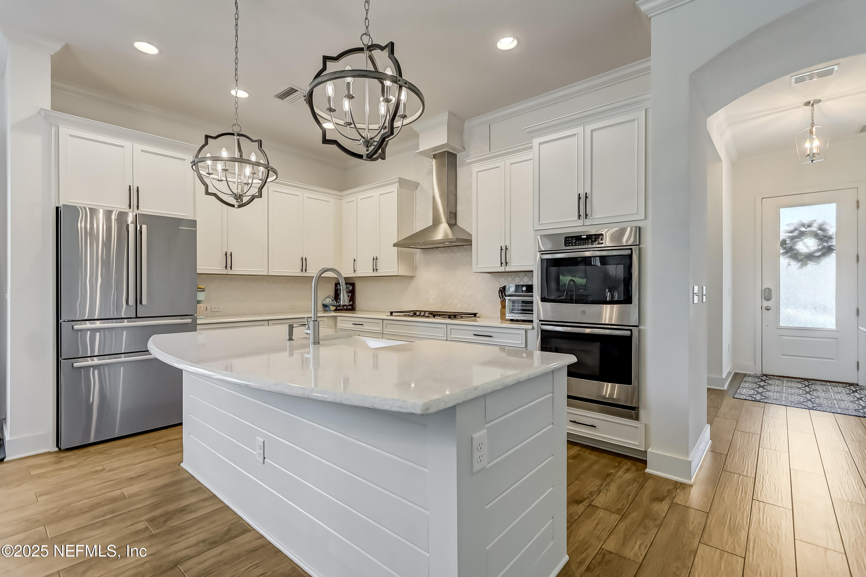 385 Daniel Park Circle Ponte Vedra, FL 32081 - Photo 12 of 34 a kitchen with stainless steel appliances granite countertop a sink a stove refrigerator and cabinets