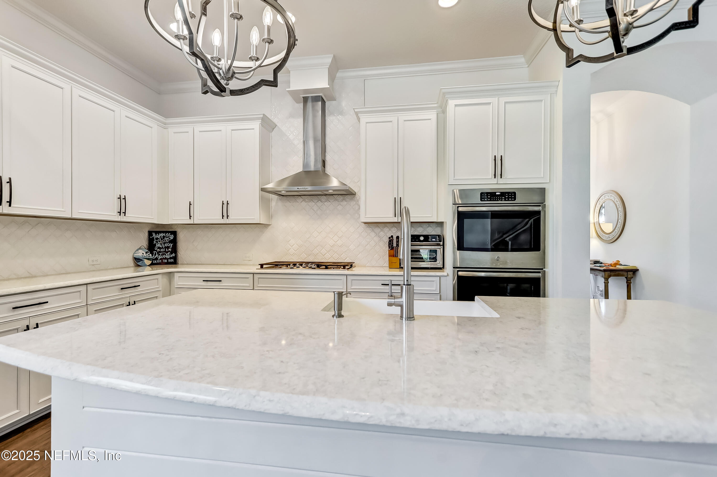 385 Daniel Park Circle Ponte Vedra, FL 32081 - Photo 16 of 34 a kitchen with stainless steel appliances granite countertop a sink a stove and cabinets