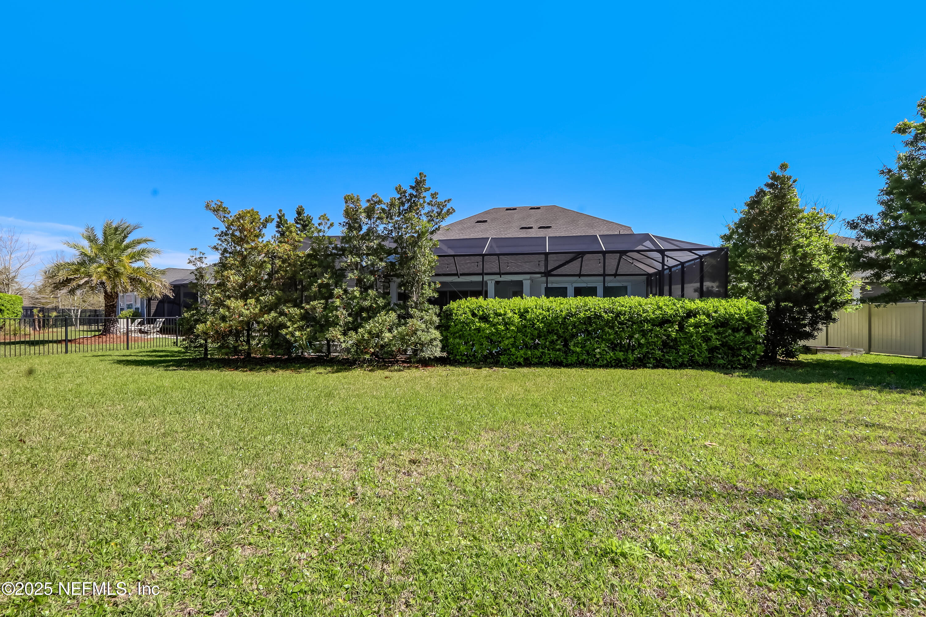 385 Daniel Park Circle Ponte Vedra, FL 32081 - Photo 32 of 34 a view of a large garden with a building in the background