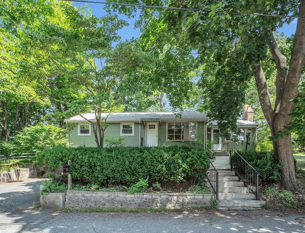 front view of a house with a yard