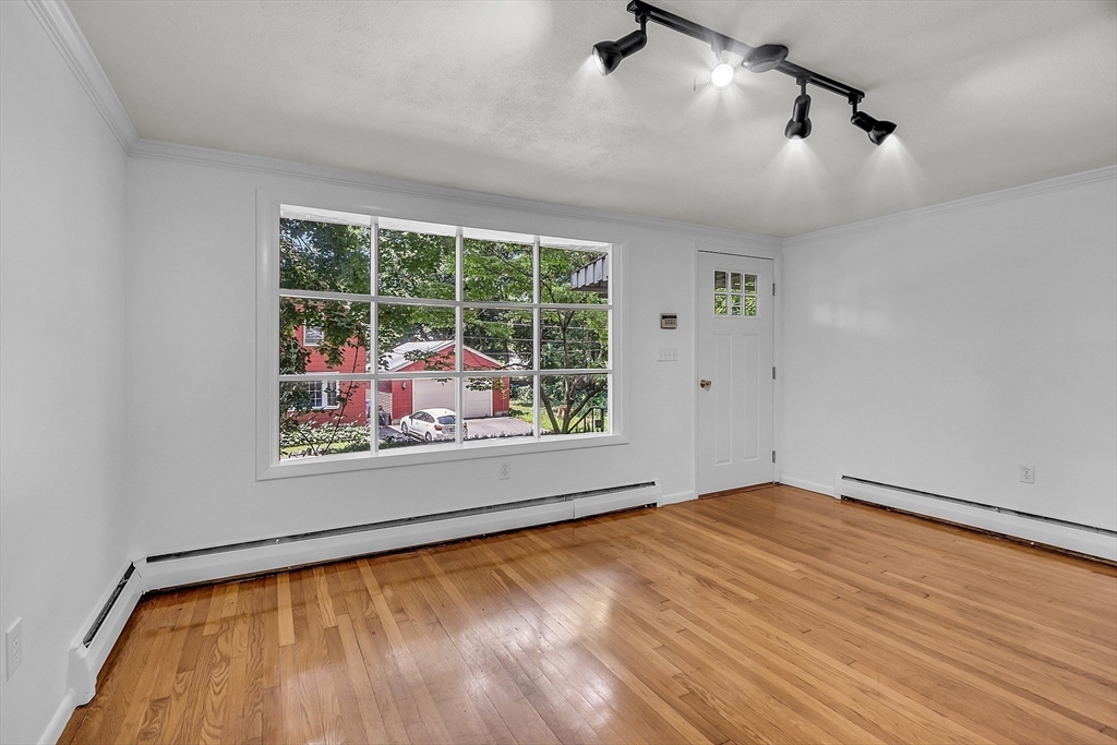 36 Mill Street Maynard, MA 01754 - Photo 20 of 42 a view of an empty room with a window