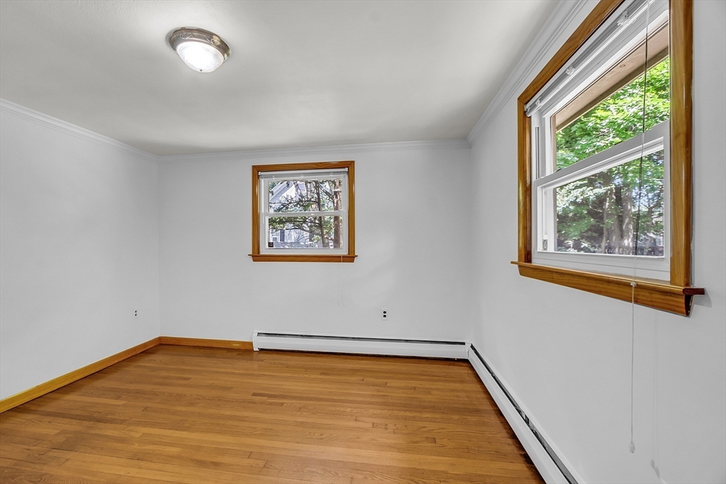 36 Mill Street Maynard, MA 01754 - Photo 24 of 42 a view of room with window and wooden floor